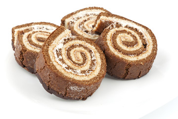 Four chocolate roll on a plate