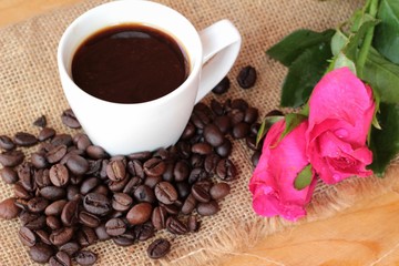 Coffee with coffee beans and red hearts.