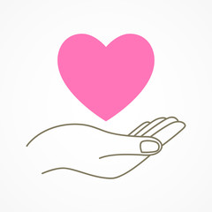 Hand holding a heart shape symbol