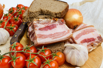 Two pieces of salty bacon with rye bread