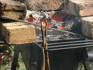 Smith tools on the background of hot coals