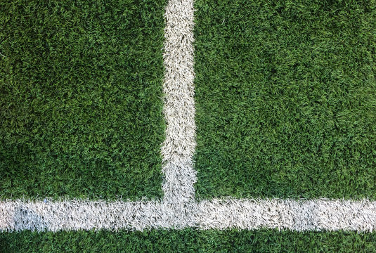 White Stripe Line on Artificial Green Soccer Field as Copyspace to input Text from Top View used as Template