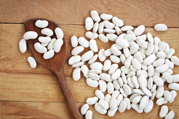 White beans on a wooden board