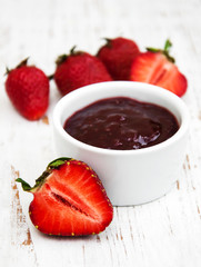 Strawberry jam and fresh strawberries