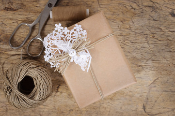 Wrapping eco gift packages with brown paper and string