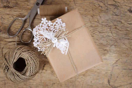 Wrapping Eco Gift Packages With Brown Paper And String