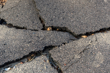 Layer of broken asphalt road at rural areas.