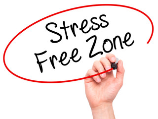 Man Hand writing Stress Free Zone with black marker on visual sc