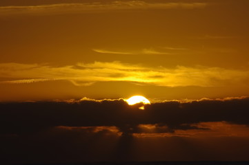 Fototapeta na wymiar Bright orange and yellow colors sunset sky
