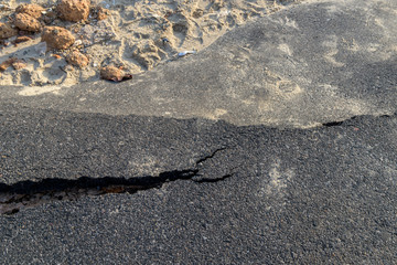 Layer of broken asphalt road at rural areas.