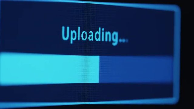 Footage of computer display screen with uploading bar filling the space. Shot on RED Cinema Camera.