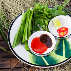 Sauce for Pho Vietnamese Beef noodle soup Hoisin Sauce, Hot sauce on wooden background