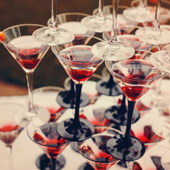 Rows of Champagne Glasses with Color Cocktails