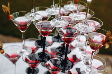 Rows of Champagne Glasses with Color Cocktails