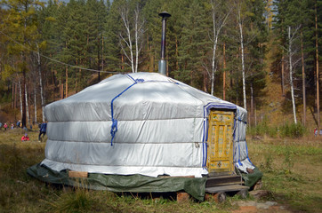 Nomadic yurt for tourists on hiking trail camp in autumn