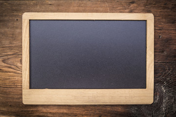 Chalkboard on Old wood texture background