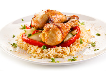Roasted chicken drumsticks white rice and vegetables