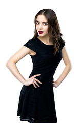 Fototapeta premium Beautiful young woman wearing black dress on white background