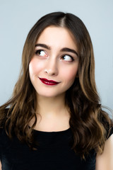 Naklejka premium Close up portrait of Happy emotional young woman with smile