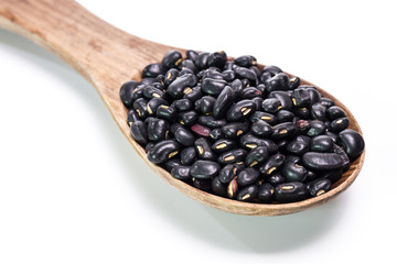 black beans in wooden spoon