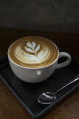 Hot Latte coffee in white cup.