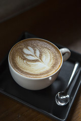 Hot Latte coffee in white cup.