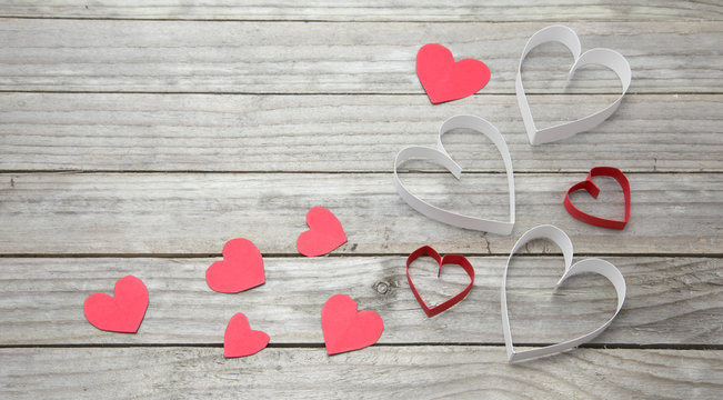 Assorted hearts on wood background