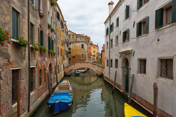 Fototapeta na wymiar Gondola on one of the canals in Venice, Italy