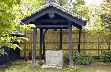 Japanese ancient well . Japan, the island of Hokkaido , Village Samurai