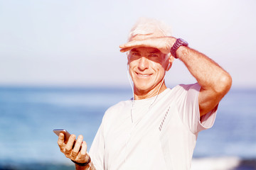 Naklejka premium Sports and music. man getting ready for jogging