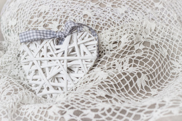 White woven heart on crochet lace