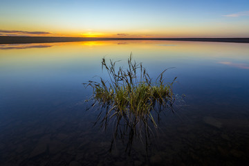 Summer landscape with river, waves and sun 