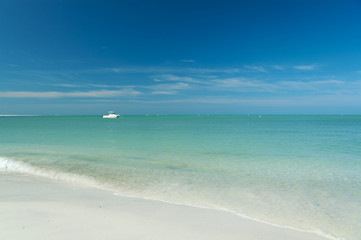 beautiful beach with boat in ocean, Florida, USA
