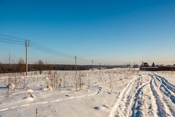 Fototapeta na wymiar Photo of the winter field. Winter landscape, blue sky, bright sunny day. Russia.