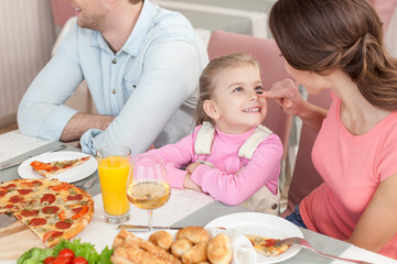 Pretty friendly family is dining together