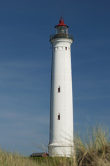 Lynvig Lighthouse against blue sky at the Danish North Sea coast, Lynvig Fyr, Noerre Lyngvig, Jutland, Denmark, Europe
