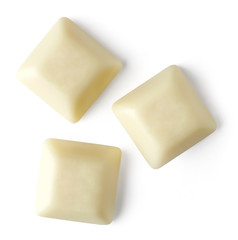 White chocolate pieces on white background