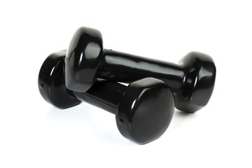 Dumbbells isolated. Pair of black rubber coated dumbbells isolated on white background