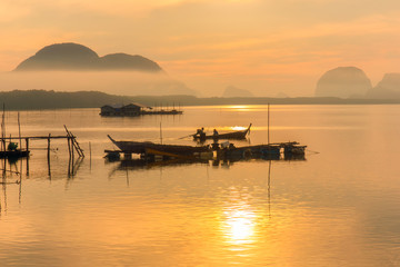 Good morning fishing village and sunrise at Sam Chong-tai, Phang Nga, Thailand, edit warm tone