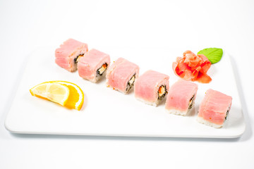 Salmon and caviar rolls served on a plate