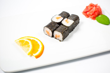 Salmon and caviar rolls served on a plate