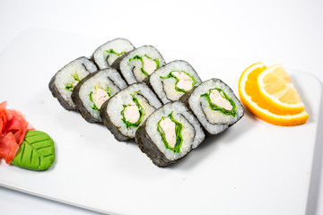 Salmon and caviar rolls served on a plate