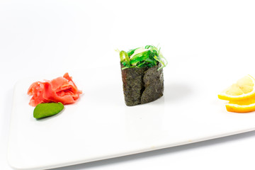 Salmon and caviar rolls served on a plate