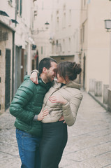 Fototapeta na wymiar Young couple in love in the small italian city