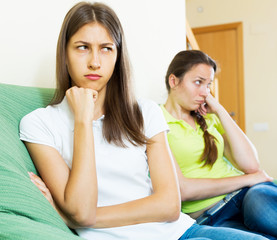 Sad young women looking away