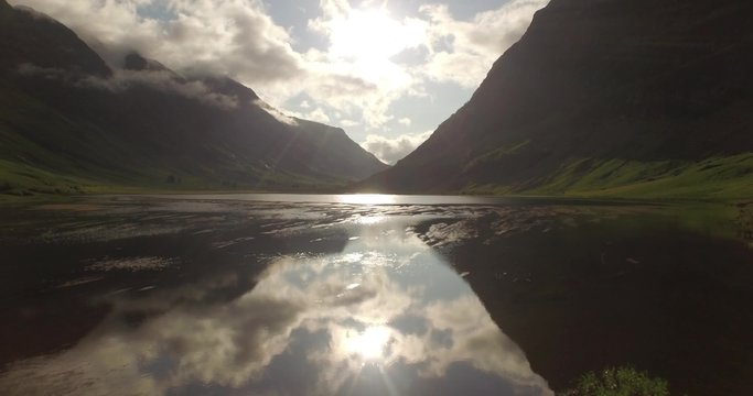 Beautiful aerial shot of Glencoe and Glen Etive in the Scottish highlands on a beautiful sunny day 
