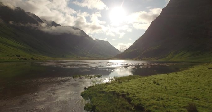 Beautiful aerial shot of Glencoe and Glen Etive in the Scottish highlands on a beautiful sunny day 
