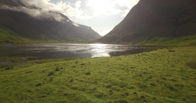 Beautiful aerial shot of Glencoe and Glen Etive in the Scottish highlands on a beautiful sunny day 
