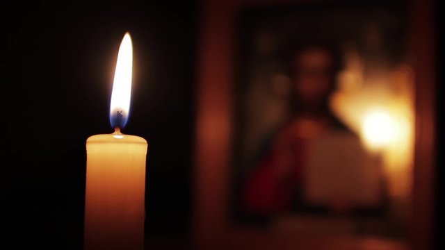Candle on the background of the icon