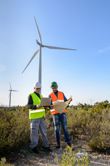 Fototapeta na wymiar Engineers of Wind Turbine / Engineers of wind turbine control projects and production.